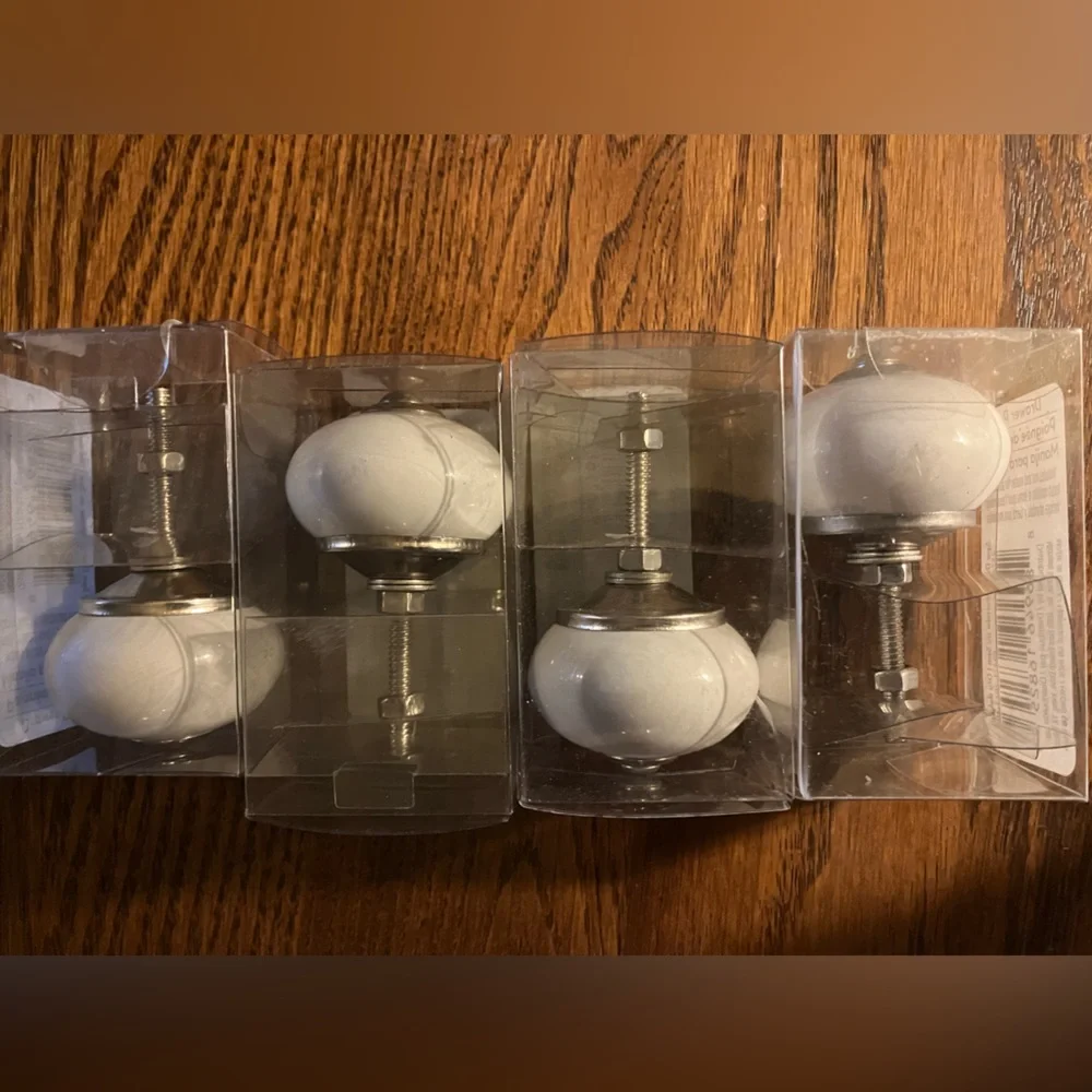 Set of 4 White Ceramic Drawer Knobs never used, still unopened.